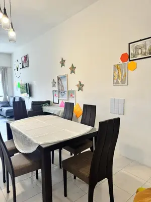 a dining room with a table and chairs at AYAAN HOMESTAY HiLL ViEW IIN FREE WIFI & NETFLIX in Tanah Rata