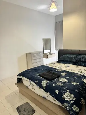 a bedroom with a bed and a dresser in it at AYAAN HOMESTAY HiLL ViEW IIN FREE WIFI & NETFLIX in Tanah Rata