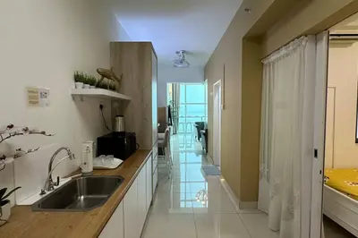 a kitchen with a sink and a counter at Seaview Seafront Duplex in Town with WiFi & Full Kitchen 66 in Georgetown