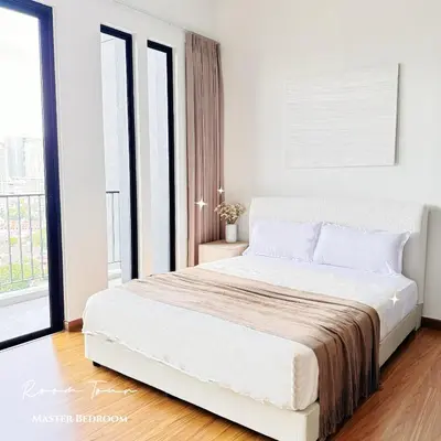 a white bedroom with a large bed and a window at Beacon Georgetown Skypool Cityview Free 2 Carpark in George Town