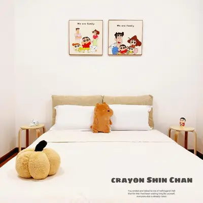 a bed with two teddy bears sitting on top of it at Beacon Georgetown Skypool Cityview Free 2 Carpark in George Town