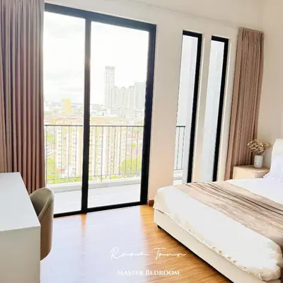 a bedroom with a bed and a large window at Beacon Georgetown Skypool Cityview Free 2 Carpark in George Town