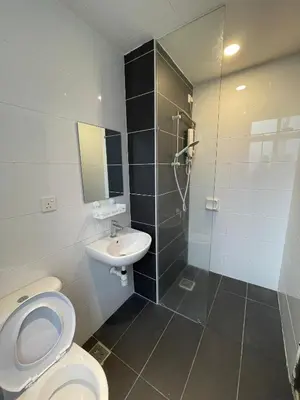 a bathroom with a toilet and a sink and a shower at The Majestic Ipoh 3BR - Goswell in Ipoh