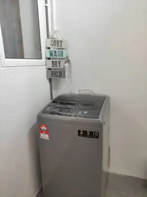 a small refrigerator with a sign on top of it at Heritage House 2BR with Dipping Pool in Town walkto Street Art 45 in George Town