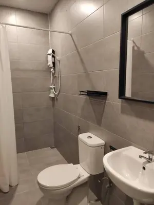 a bathroom with a toilet and a sink at Heritage House 2BR with Dipping Pool in Town walkto Street Art 45 in George Town