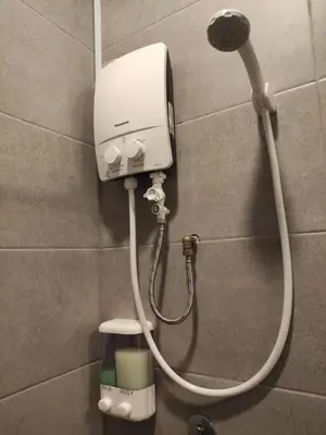 a shower head on a wall in a bathroom at Heritage House 2BR in Town walkto UNESCO Site & StreetArt 45 in George Town