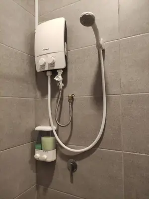 a shower head on a wall in a bathroom at Heritage House 2BR in Town walkto UNESCO Site & StreetArt 45 in George Town