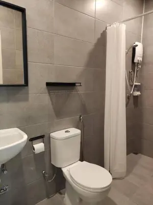 a bathroom with a white toilet and a sink at Heritage House 3BR in Town walkto UNESCO Site & StreetArt 47 in George Town