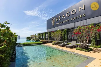 a resort with a swimming pool in front of a building at Seaview 2BR Infinity Pool & EasyAccess to Town 13A in George Town