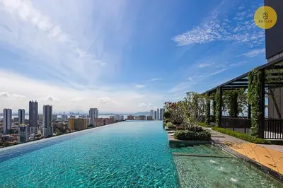 a infinity pool on top of a building with a city at Greatview 2BR Infinity Pool & EasyAccess to Town 13 in George Town