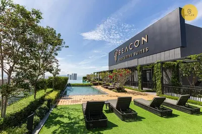 a group of chairs sitting in front of a building at Greatview 2BR Infinity Pool & EasyAccess to Town 13 in George Town