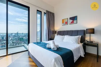 a bedroom with a large bed with a large window at Seaview 2BR Infinity Pool & EasyAccess to Town 191 in George Town