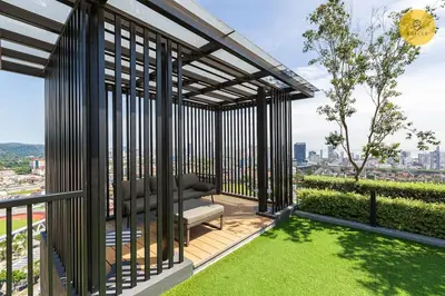a pergola with a chair on a balcony at Seaview 2BR Infinity Pool & EasyAccess to Town 191 in George Town