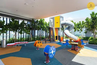 a childrens playground with a slide in a building at Seaview 2BR Infinity Pool & EasyAccess to Town 191 in George Town