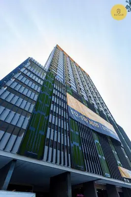a tall building with green windows on it at Seaview 2BR Infinity Pool & EasyAccess to Town 191 in George Town