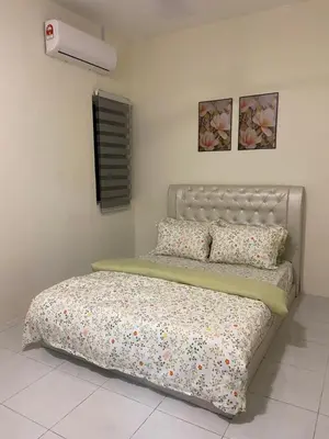 a bedroom with a bed and a air conditioner at Homestay RumahKita di Seri Iskandar in Seri Iskandar
