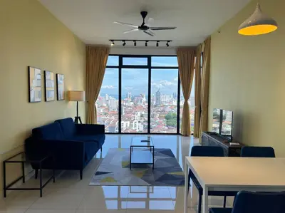 a living room with a blue couch and a large window at Seaview 2BR Infinity Pool & EasyAccess to Town 201 in George Town
