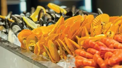 a pile of carrots and other vegetables on a table at Holiday Inn & Suites Penang Prai by IHG in Bukit Mertajam