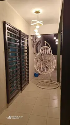 a room with a cage in the middle of a room at Homestay Iman Seri Iskandar Uitm Perak Utp in Seri Iskandar