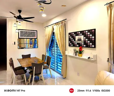 a dining room with a table and chairs at Homestay Iman Seri Iskandar Uitm Perak Utp in Seri Iskandar