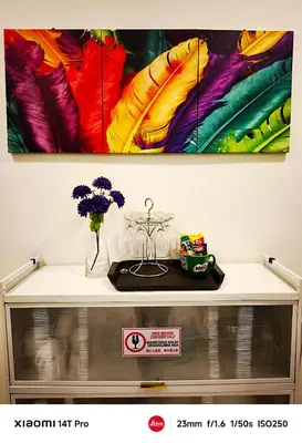 a table with vases and flowers on it at Homestay Iman Seri Iskandar Uitm Perak Utp in Seri Iskandar