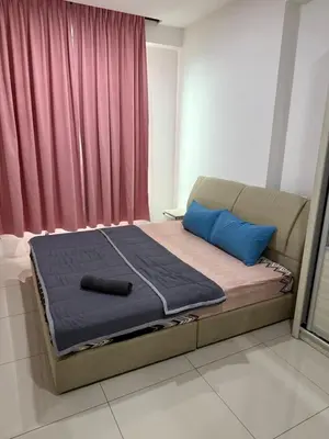 a bed in a room with a mattress and blue pillows at Casa Kayangan Meru Ipoh 3BR DAISY -by Goswell in Ipoh