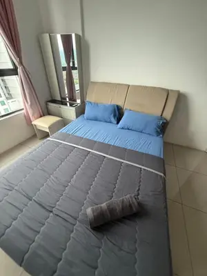 a bed in a room with blue pillows at Casa Kayangan Meru Ipoh 3BR DAISY -by Goswell in Ipoh