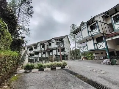 a building on the side of a street at The Family Hideaway 2 Bedroom Apartment at Equatorial Hill Resort in Brinchang