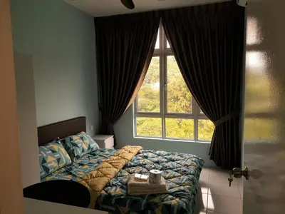 a bedroom with a bed and a large window at The Anderson Condo with NETFLIX with Free Parking with Swimming Pool and at Ipoh City Centre Nearby to all amenities and attractions in Ipoh