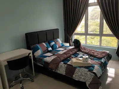 a bedroom with a bed and a desk and a window at The Anderson Condo with NETFLIX with Free Parking with Swimming Pool and at Ipoh City Centre Nearby to all amenities and attractions in Ipoh