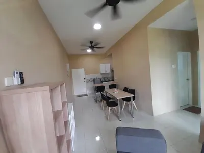 a living room with a table and chairs and a ceiling at The Anderson Condo with NETFLIX with Free Parking with Swimming Pool and at Ipoh City Centre Nearby to all amenities and attractions in Ipoh