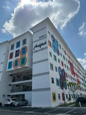a large white building with a sign on it at DyMaz Salam Homestay in Seri Iskandar