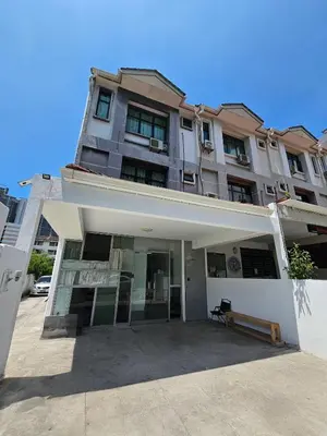a large apartment building with a large front yard at Sunny Point Hostel in Gelugor