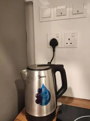 a cuisinart kettle sitting on top of a counter at Heritage House 4BR with Dipping Pool, Central Location Near Street Art 45 in George Town
