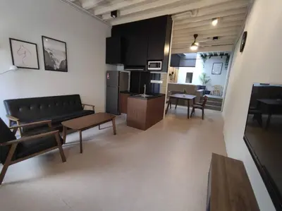 a living room with a couch and a table at Heritage House 5BR with Dipping Pool, Central Location Near Street Art 47 in George Town