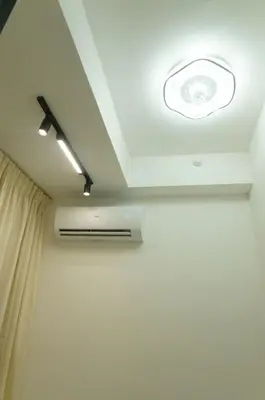 a room with a ceiling with a light at Urban Suites Infinity Pool 3BR 2Carparks 8pax in Jelutong
