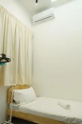 a room with a bunk bed with a window at Urban Suites Seaview 3Bedrooms 2Carparks 8pax in Jelutong