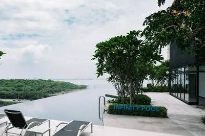 a view of the infinity pool of a building with a river at Urban Suites Seaview 3Bedrooms 2Carparks 8pax in Jelutong