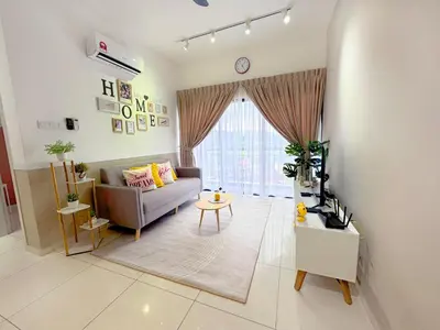 a living room with a couch and a table at Decozy 9 Ipoh Town Condo 12pax in Ipoh
