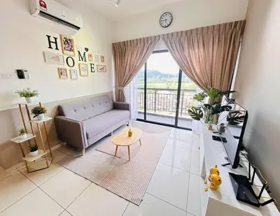 a living room with a couch and a table at Decozy 9 Ipoh Town Condo 12pax in Ipoh