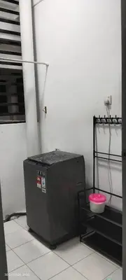 a cpu in a room with a pink bowl at Nana Homestay in Parit Buntar