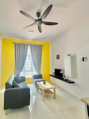 a living room with a couch and a ceiling fan at Ipoh Anderson Cozy downtown in Ipoh