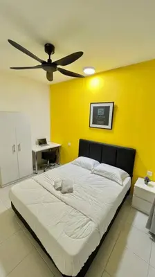 a bedroom with a bed with a ceiling fan at Ipoh Anderson Cozy downtown in Ipoh