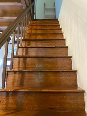a set of wooden stairs in a house at EastOriental House in George Town