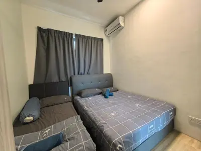 a small bedroom with a bed and a window at Platinum Suite Meritus by Moowin in Perai