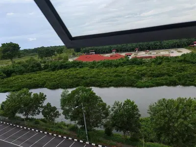 an overhead view of a parking lot with trees at Comfortable Greenery in Seri Iskandar