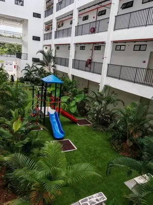 a playground in the yard of a building at Comfortable Greenery in Seri Iskandar