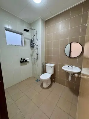 a bathroom with a toilet and a sink at Rimbayu 81 in Kampung Bota Kiri