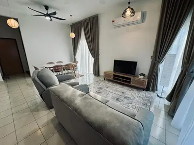 a living room with two couches and a television at Rimbayu 81 in Kampung Bota Kiri