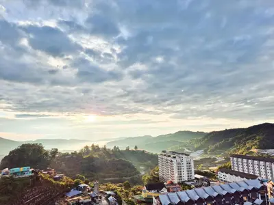 a view of a city with mountains in the background at Mossy Forest Family Retreat III, 2-8pax, Sunrise View, Cameron Highlands in Cameron Highlands